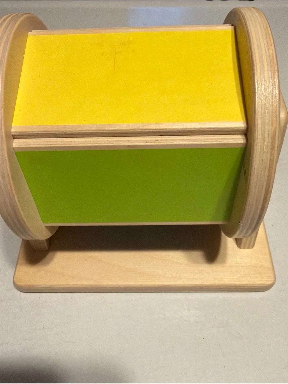 Lovevery brand Wooden Spin Learning Drum Toy in Yellow and Green